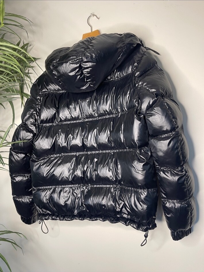 Back view of the actual glossy black PAJAR Canada puffer jacket and hood